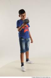 TIMBO STANDING POSE WITH GUN